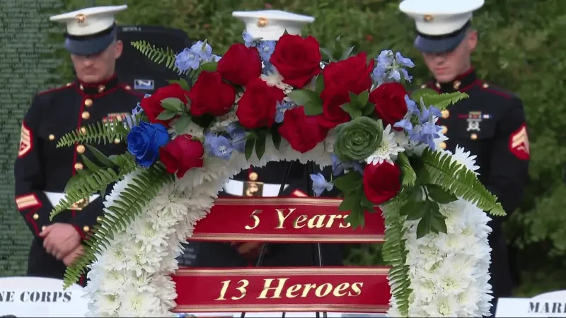 Candlelight vigil at Lejeune Memorial Gardens honors 13 fallen from Afghanistan