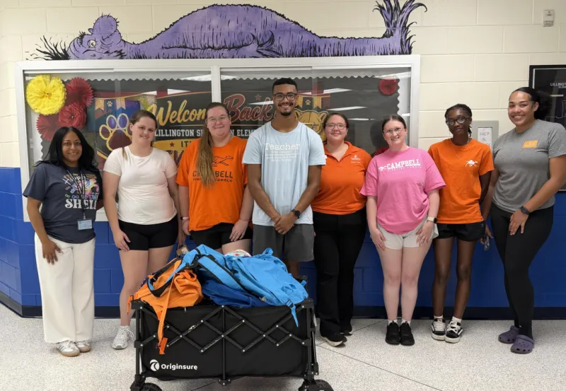 Teaching scholars lead Backpack Buddies service project