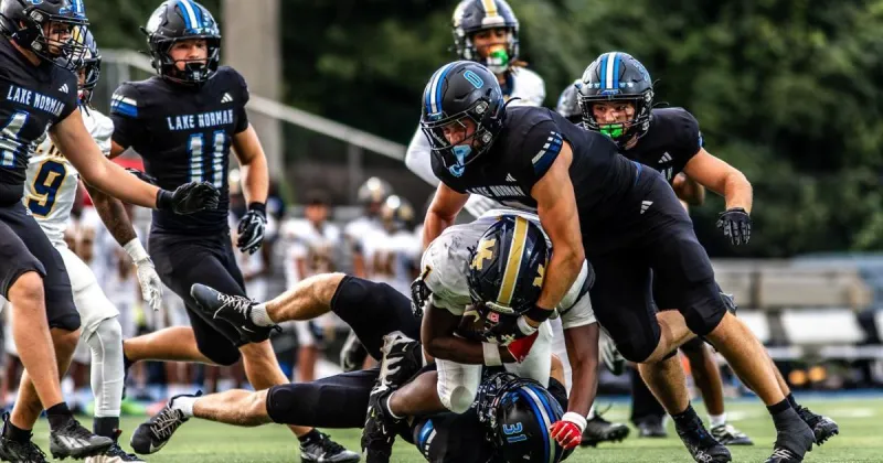 Lake Norman rolls on history-making night for its coach