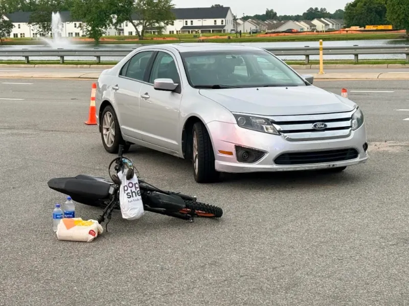 Car, Electric Bike Collide On NC 42 East