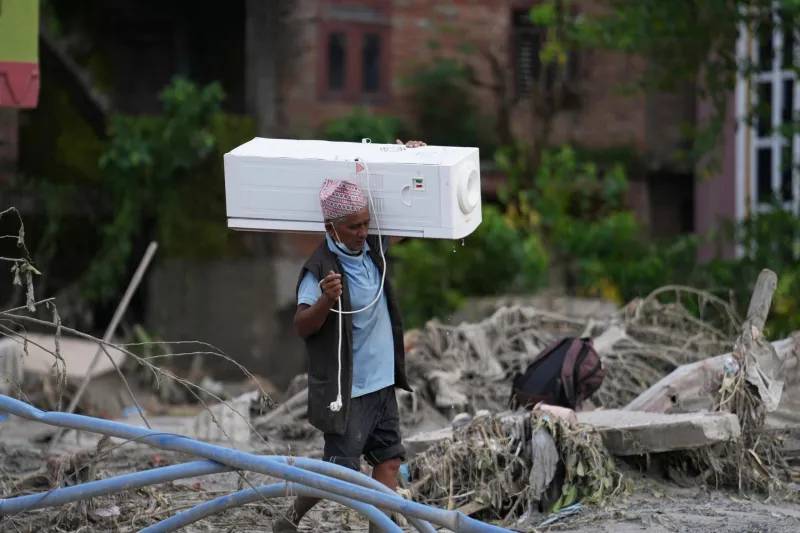 Mass burials in Nepal as death toll from flash floods exceeds 1,000