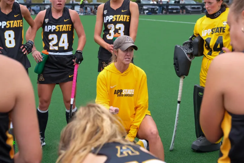 Hard work pays off in Emily Dinsmore's journey from player to Division I head coach