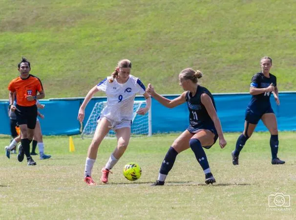 Hawks Battle Trojans Behind Goals from Baxter and Palmer