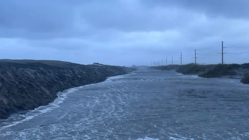N.C. 12 covered by up to 4 feet of water, deep sand at Pea Island
