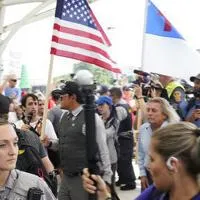 How do white supremacists group recruit members?