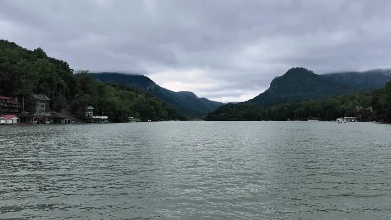 Lake Lure dam gates opening; rising water levels downstream along Broad River