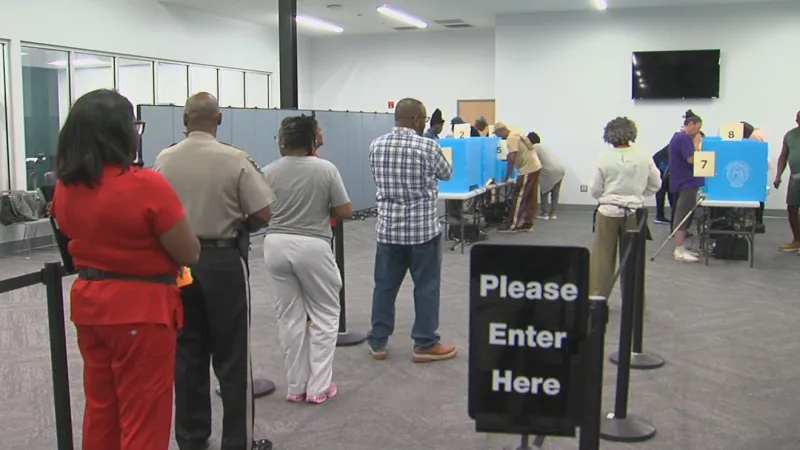 Georgia voters break turnout record on first day of early voting for midterms