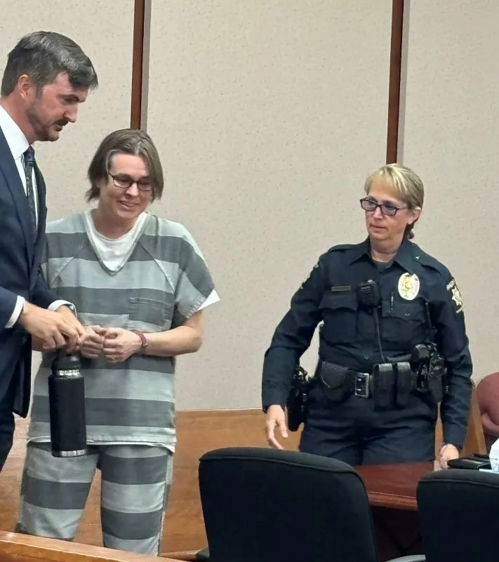 Young children of murder suspect confused by their mother's detention, her friend says