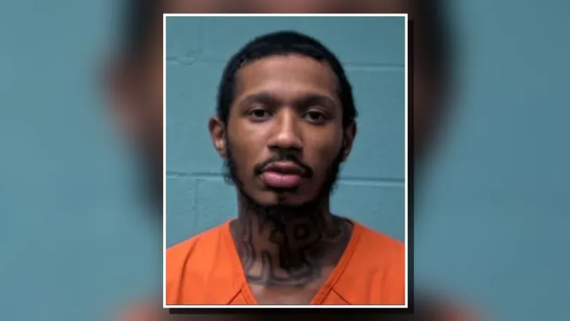 Kinston man charge after rifle found during search