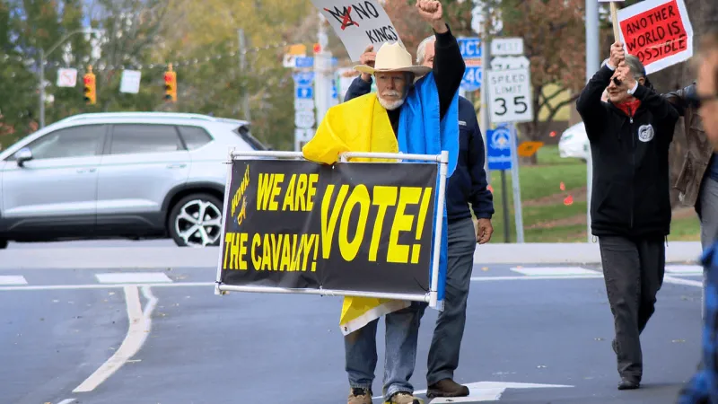 Hundreds join Asheville 'No Kings' march urging early voting