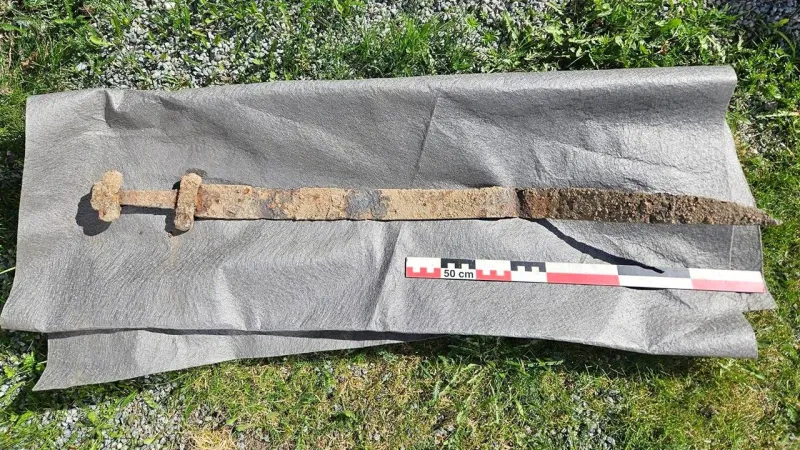 Ancient Viking sword discovered 'sticking up out of the ground' after 1,300 years