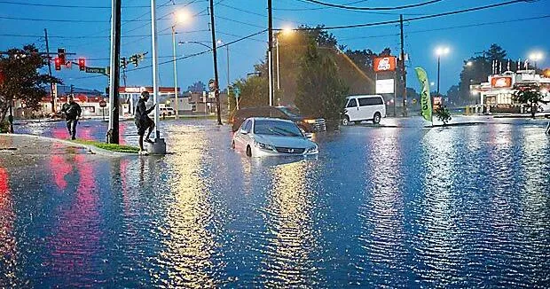 Tropical storm remnants drench Gulf states after tornadoes hit the Midwest