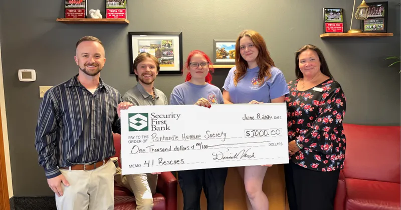 Security First Bank donates $1,000 to Panhandle Humane Society