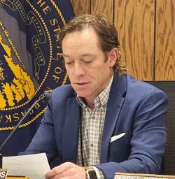 County commissioner apologizes, returns to board