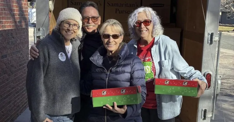 Local volunteers prepare to fill shoeboxes for children around the world