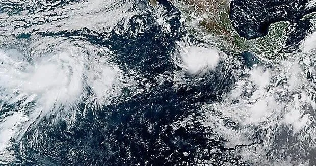 Powerful Hurricane Polo drenches Mexico's coast from offshore as Nolo nears Hawaii