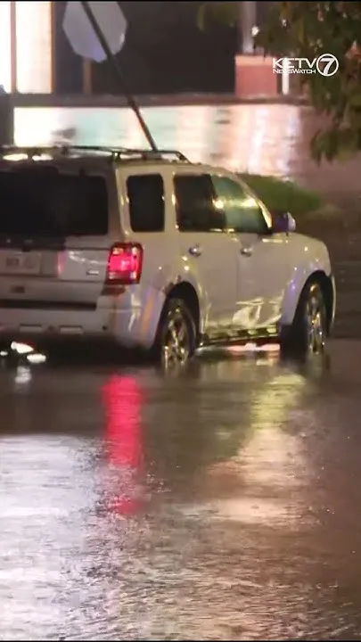 Omaha area drivers run into flooded streets due to heavy rainfall (Video)