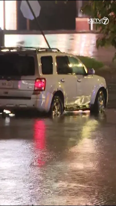 Omaha area drivers run into flooded streets due to heavy rainfall (Video)