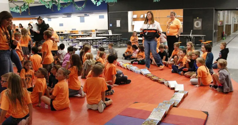 Beatrice Elementary stamps out hunger, domino style