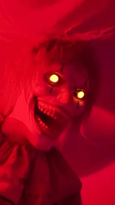 Killer clowns wait for their next victim as zombies try to break free at this interactive yard haunt (Video)