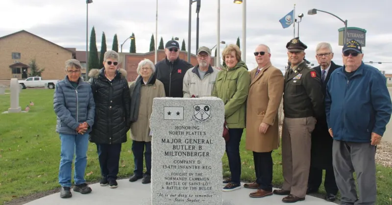 Company D kids cheer 'long time coming' 134th Infantry marker