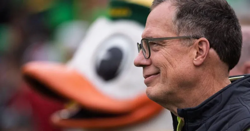 Oregon president grew up a Husker fan. Today, he's rooting for the Ducks.