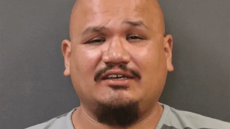 Grand Island man accused of breaking into home, threatening woman with gun