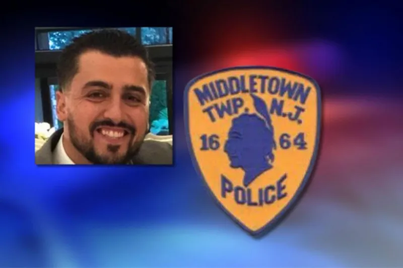 Middletown cop charged over woman's mugshot
