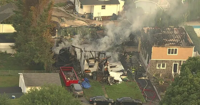 Firefighters battle large blaze engulfing two homes in Belleville, New Jersey