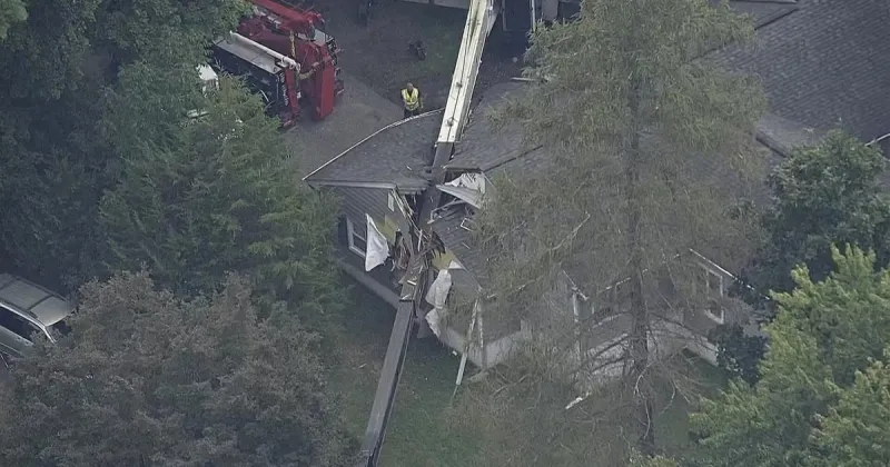Crane topples into home in River Vale, N.J.