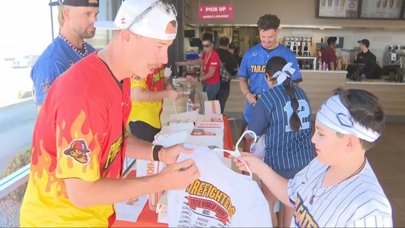 Banana Ball players serve fans at El Paso Dunkin'