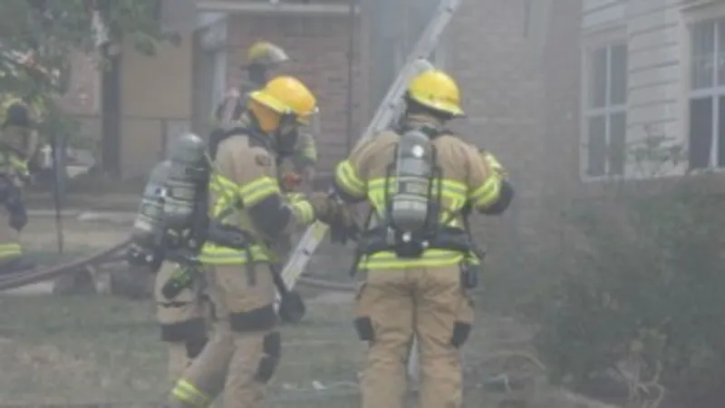 Roof collapse forces firefighters out as they battle blaze at two homes