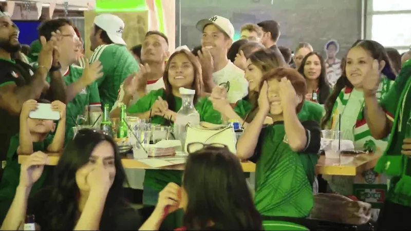 Local fans celebrate Mexico's World Cup opening victory over South Africa