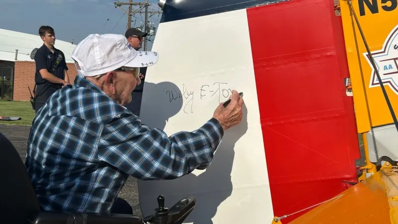 World War II veteran flies in vintage biplane days before 100th birthday