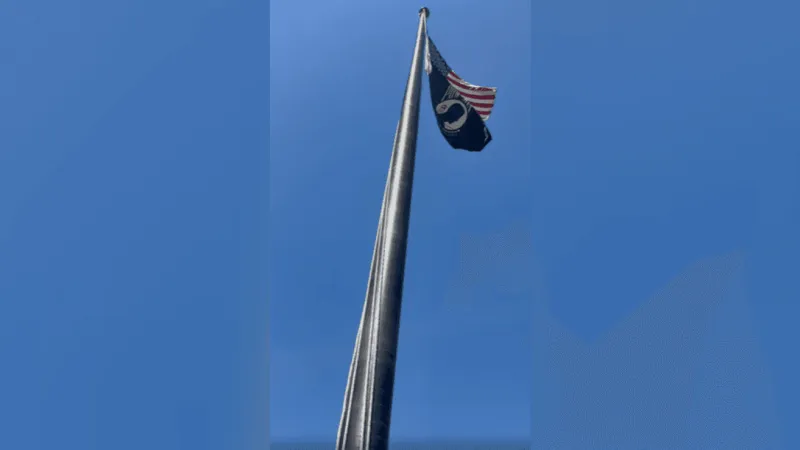 Street preacher raises post office flag, protesting Trump's order honoring Dolly Parton