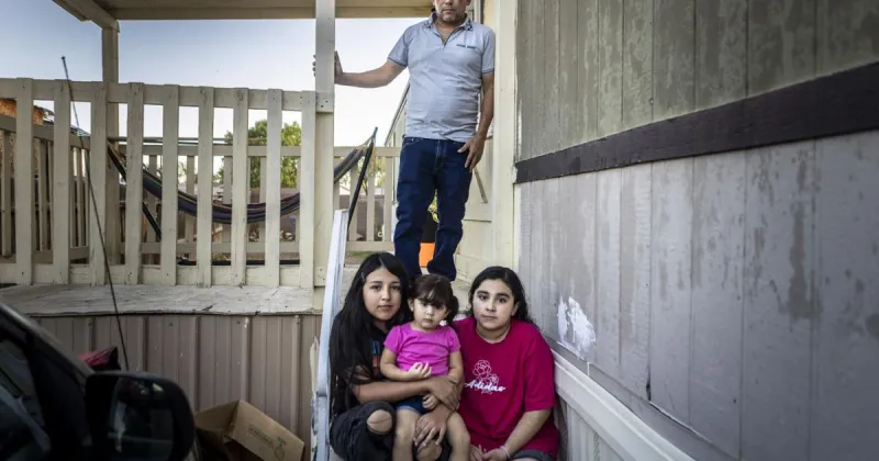 He had legal status and no criminal convictions; he was arrested and jailed anyway