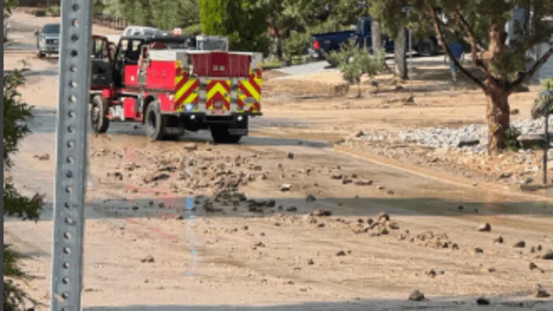 Flooding hits Hidden Valley after heavy rain, with water in homes and mud-covered streets