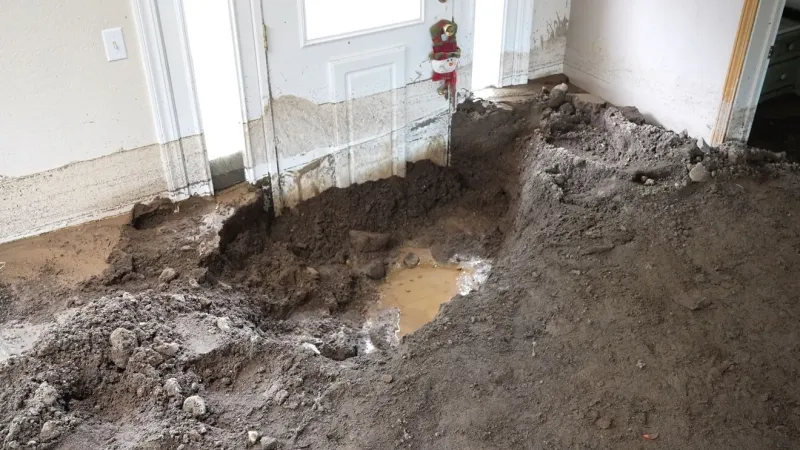 Feet of mud, costly repairs for Hidden Valley flash flood victim as cleanup continues