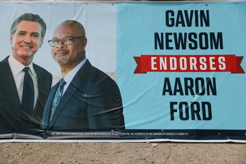 Political signs in Las Vegas with Newsom's image defaced with swastikas