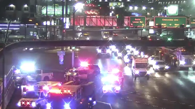 Pickup hits barrier on Cheyenne Bridge, debris falls onto I-15