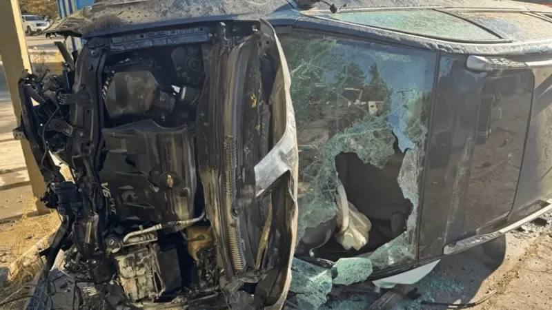 Crash damages streetlight, fencing and security cameras; no other injuries reported
