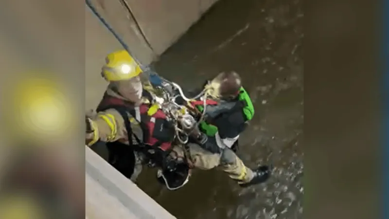 Firefighters rescue man who fell into Las Vegas drainage tunnel during storm