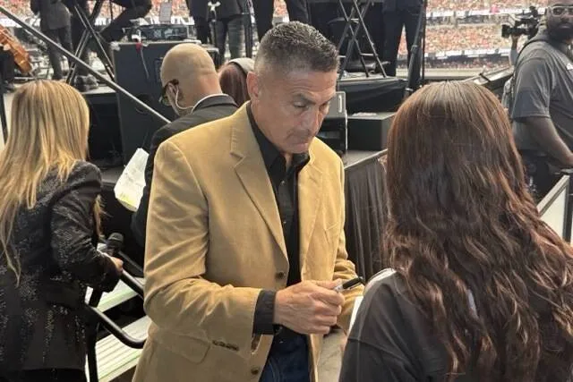 Ex-Raiders punter Leo Araguz lights Al Davis torch during Hispanic Heritage Month