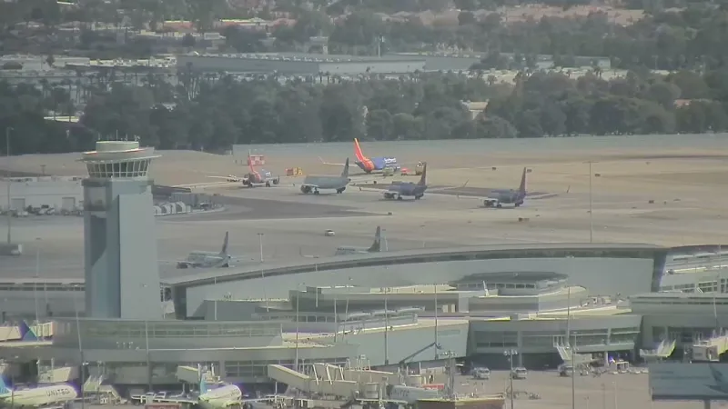 Report of smoke from landing gear forces plane to return to Las Vegas airport gate