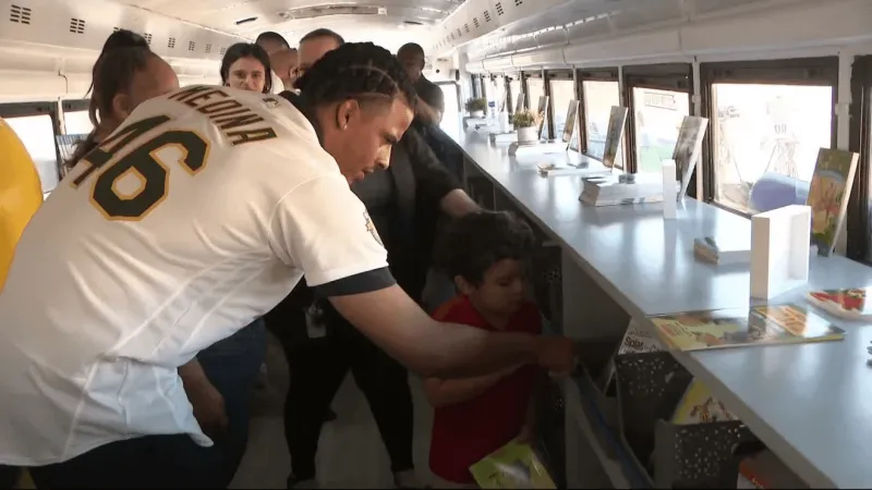 A's bring book bus, classroom support to Jack Dailey Elementary School