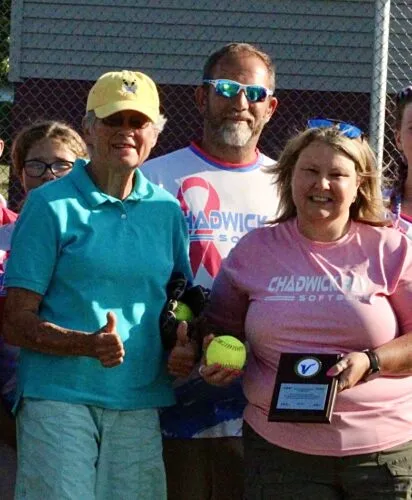 Hero throws first pitch at softball tourney