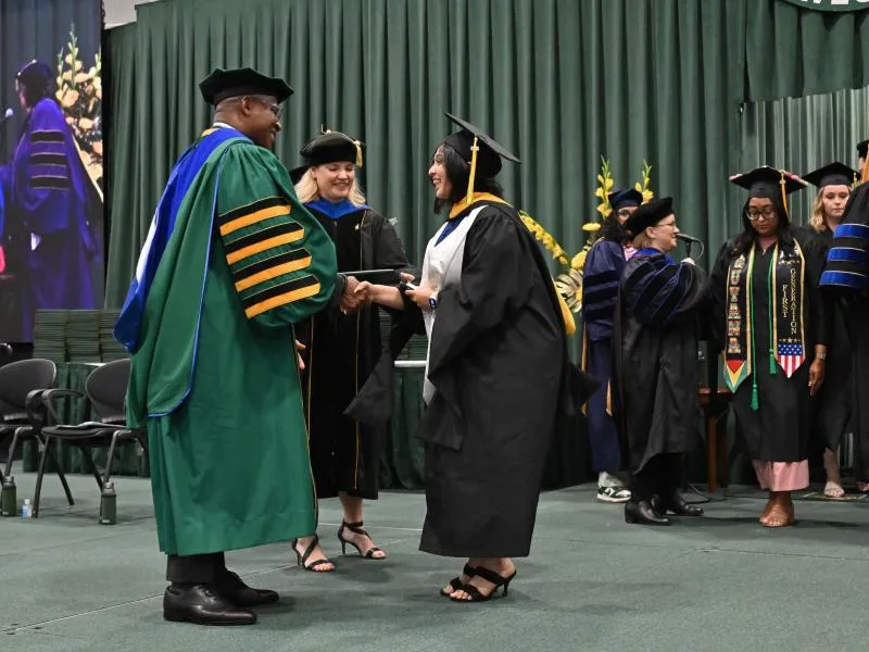 International student graduates in three years with master's, undergraduate degrees
