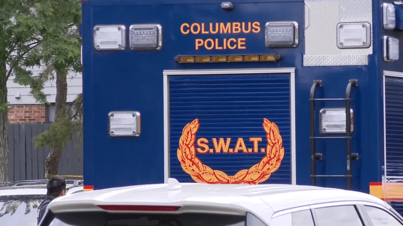 S.W.A.T. and helicopters search for armed suspect near South Side homeless camp