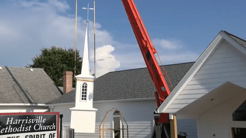 Nearly century-old church raises new steeple as expansion peaks, drawing hundreds