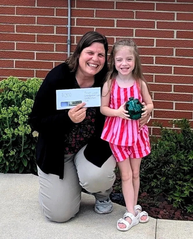 Student Raises $1,300 for Her Own School Through Piggy Bank Philanthropy